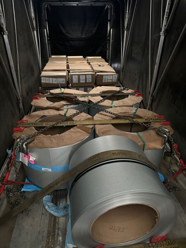 Interior of shipping container with secured load.